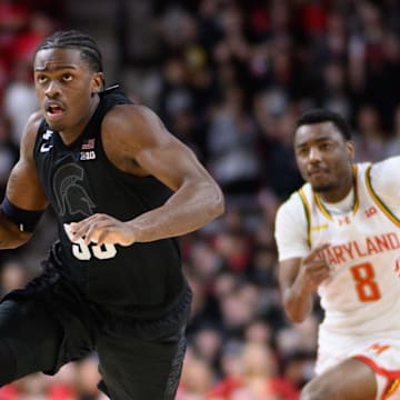 Feb 26, 2025; College Park, Maryland, USA; Michigan State Spartans forward Coen Carr (55) handles the ball during the first half against Maryland Terrapins guard Rodney Rice (1) at Xfinity Center. Mandatory Credit: Reggie Hildred-Imagn Images