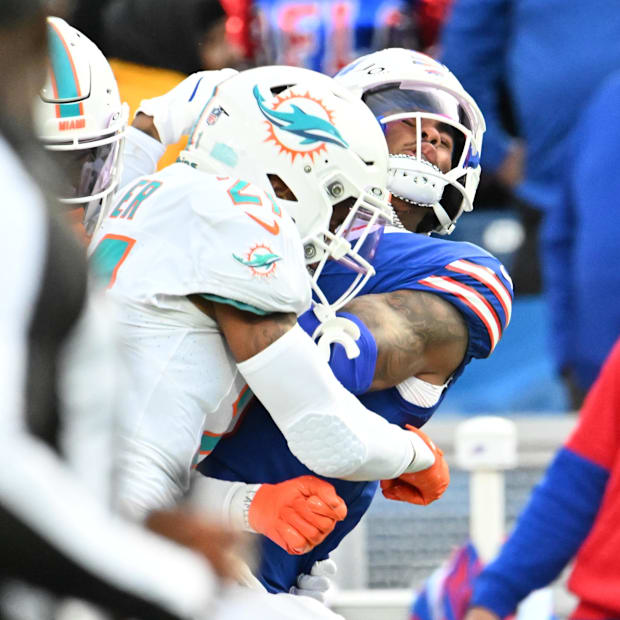 Keon Coleman (0) is hit 