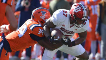 Nov 11, 2023; Champaign, Illinois, USA;  Illinois Fighting Illini linebacker Kenenna Odeluga (39) tackles Indiana Hoosiers linebacker Xavier Trueblood (97)during the first half at Memorial Stadium. Mandatory Credit: Ron Johnson-USA TODAY Sports