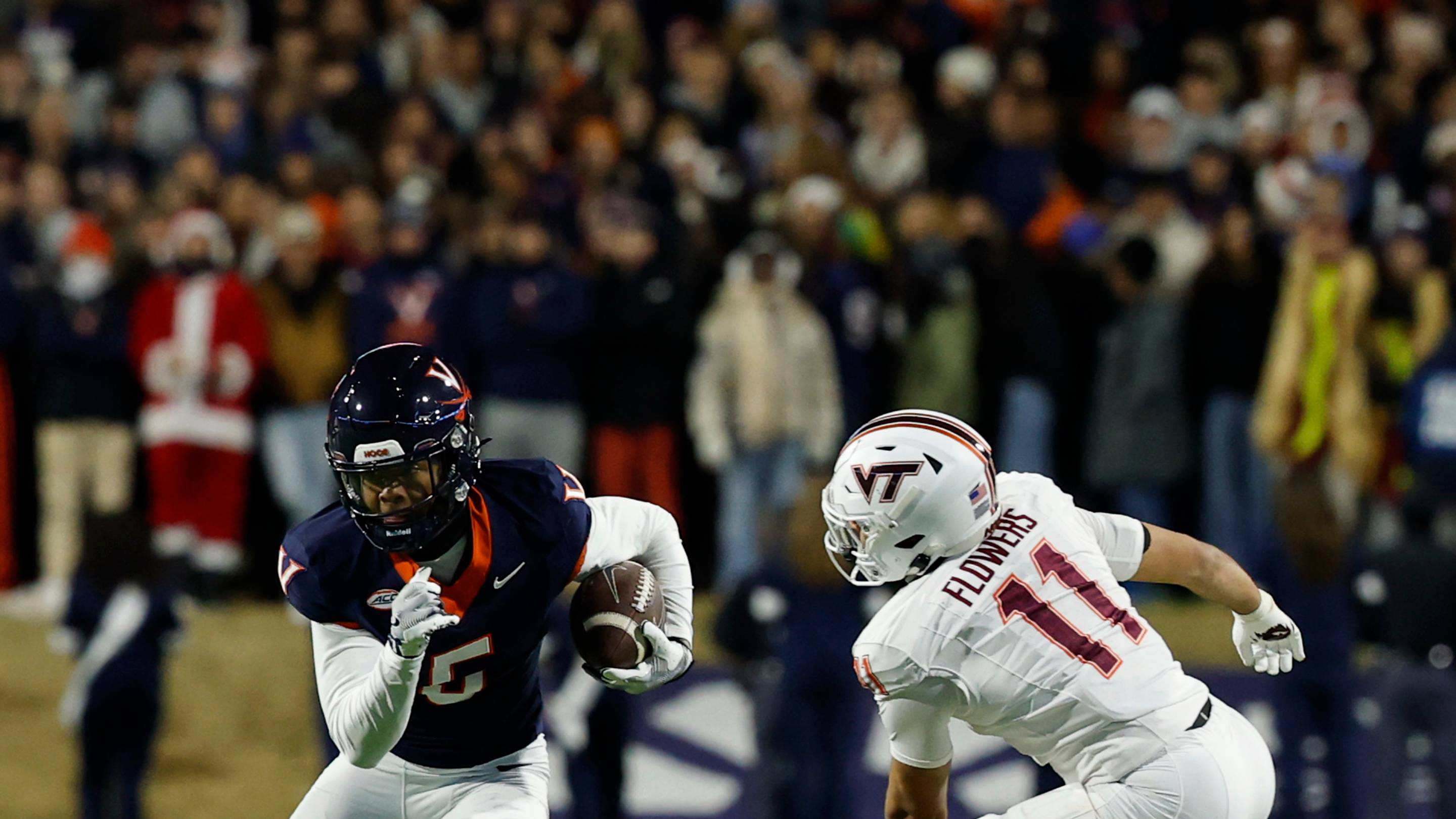 Nov 29, 2025; Charlottesville, Va.; Virginia wide receiver Kameron Courtney (5) runs with the ball as Virginia Tech cornerback Thomas Williams (23) and safety Tyson Flowers (11) chase.
