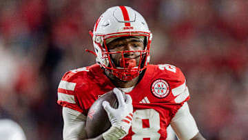 Nebraska running back Kwinten Ives runs for a 28-yard touchdown against Akron.