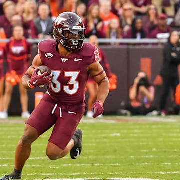 Virginia Tech Hokies running back Bhayshul Tuten runs after a catch against the Clemson Tigers at Lane Stadium.