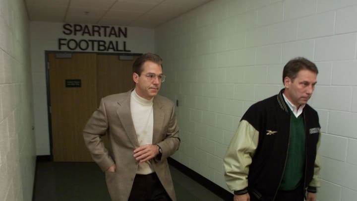 Nov 30, 1999; Former Spartans football coach Nick Saban, left, accompanied by Spartans basketball
