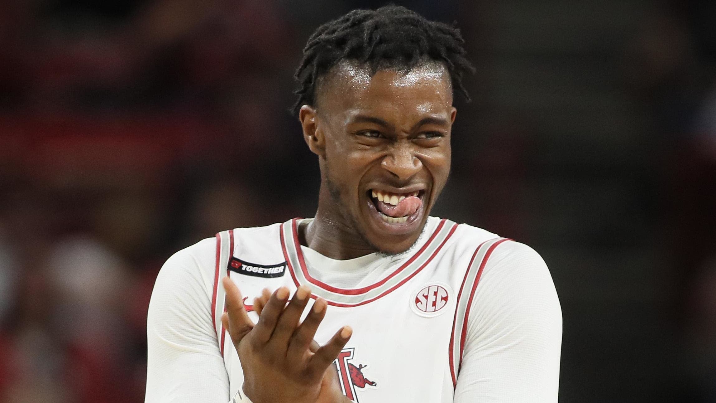 Arkansas guard Davonte Davis (4) reacts to a big play 