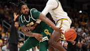 Mar 16, 2025; Washington, D.C., USA; George Mason Patriots forward Jalen Haynes (11) passes the ball as VCU Rams forward Christian Fermin (21) defends in the first half at Capital One Arena. Mandatory Credit: Geoff Burke-Imagn Images