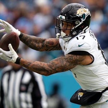 Jacksonville Jaguars tight end Evan Engram (17) hauls in a pass against the Tennessee Titans during their game at Nissan Stadium in Nashville, Tenn., Sunday, Jan. 7, 2024.