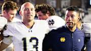 Notre Dame Fighting Irish coach Marcus Freeman and quarterback CJ Carr (13) after defeating the Boston College Eagles at Alumni Stadium. 