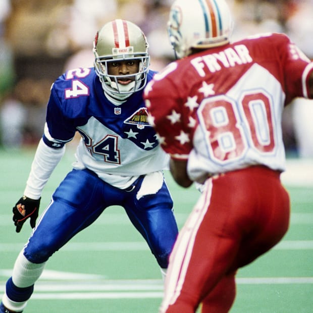 San Francisco 49ers defensive back Deion Sanders (24) in action against Miami Dolphins receiver Irving Fryar (80).