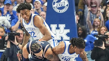 Kentucky Wildcats guard Otega Oweh (00) steals the ball from Auburn Tigers forward Johni Broome (4) during the first half in SEC basketball at Rupp Arena Saturday afternoon in Lexington, Kentucky March 1, 2025
