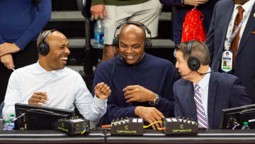 Former Auburn basketball player Charles Barkley jokes with announcers Jay Williams, left, and Roxy