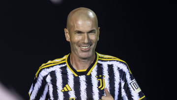 Zinedine Zidane smiles as he enters the pitch during the'...
