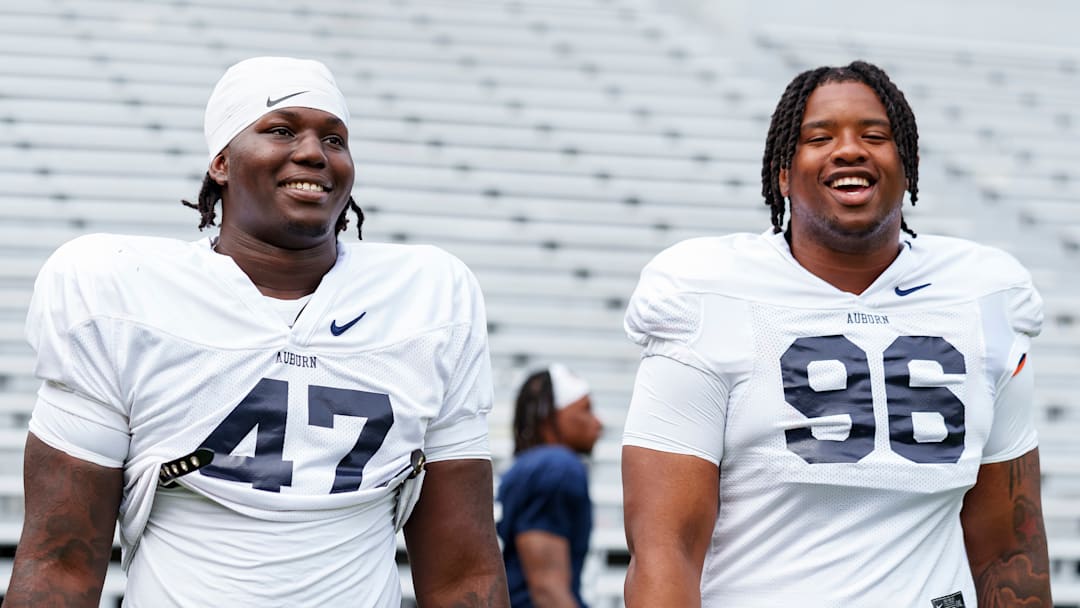 Auburn Defensive Linemen Malik Blocton (#47) and Malik Autry (#96) before a fall camp practice at Jordan-Hare Stadium. Auburn Defensive Linemen Malik Blocton (#47) and Malik Autry (#96) before a fall camp practice at Jordan-Hare Stadium.