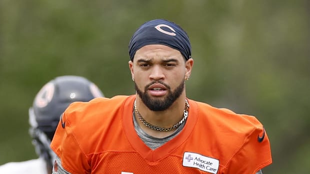 Chicago Bears quarterback Caleb Williams (18) looks on during minicamp
