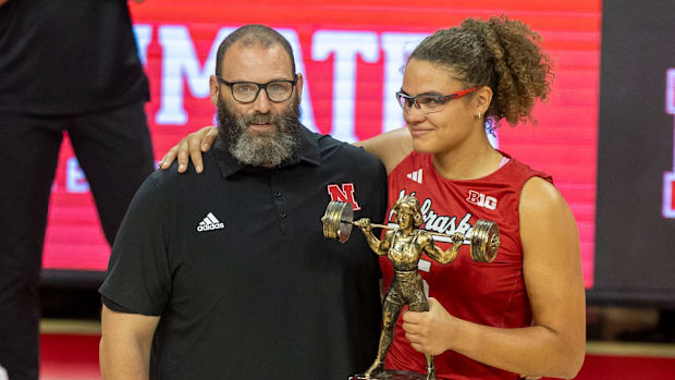 Nebraska middle blocker Rebekah Allick poses with Director of Olympic Sports Performance Brian Kmitta.