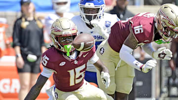 Sep 14, 2024; Tallahassee, Florida, USA; Florida State Seminoles wide receiver Lawayne McCoy (15) fumbles a punt return against the Memphis Tigers during the first half at Doak S. Campbell Stadium. Mandatory Credit: Melina Myers-Imagn Images