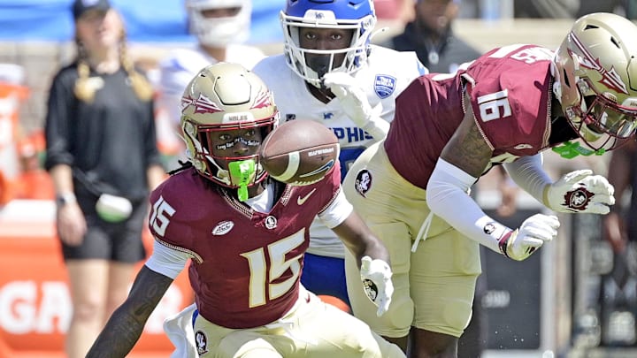 Sep 14, 2024; Tallahassee, Florida, USA; Florida State Seminoles wide receiver Lawayne McCoy (15) fumbles a punt return against the Memphis Tigers during the first half at Doak S. Campbell Stadium. Mandatory Credit: Melina Myers-Imagn Images