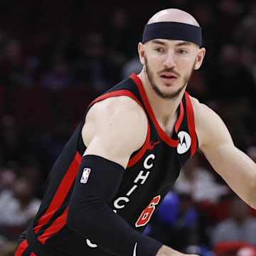 Apr 1, 2024; Chicago, Illinois, USA; Chicago Bulls guard Alex Caruso (6) drives to the basket against the Atlanta Hawks during the first half at United Center. Mandatory Credit: Kamil Krzaczynski-Imagn Images