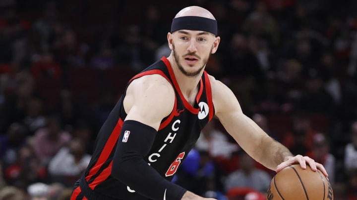 Apr 1, 2024; Chicago, Illinois, USA; Chicago Bulls guard Alex Caruso (6) drives to the basket against the Atlanta Hawks during the first half at United Center. Mandatory Credit: Kamil Krzaczynski-USA TODAY Sports