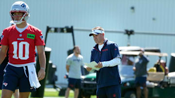 Patriots offensive coordinator Josh McDaniels keeps an eye on his quarterbacks during opening day of New England Patriots training camp on July 23, 2025, at Gillette Stadium in Foxboro, Massachusetts.