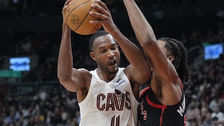 Apr 23, 2026; Toronto, Ontario, CAN; Cleveland Cavaliers forward Evan Mobley (4) battles with Toronto Raptors forward Collin Murray-Boyles (12) during the second half of game three of the first round of the 2026 NBA Playoffs at Scotiabank Arena. Mandatory Credit: John E. Sokolowski-Imagn Images