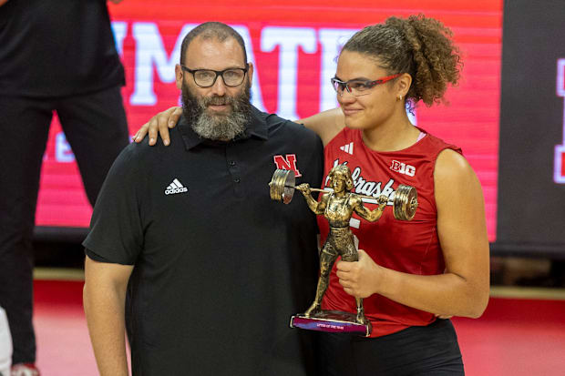 Nebraska middle blocker Rebekah Allick poses with Director of Olympic Sports Performance Brian Kmitta.