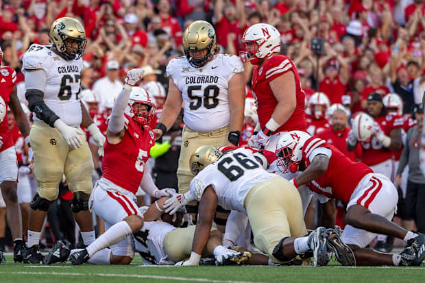 Nebraska defenders react after stopping Colorado running back Charlie Offerdahl for a loss on fourth-and-1.