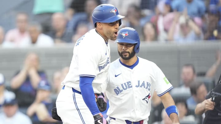 Jun 27, 2024; Toronto, Ontario, CAN; Toronto Blue Jays right fielder George Springer (4) reacts after scoring on his three-run home run against the New York Yankees that also scored second baseman Isiah Kiner-Falefa (7) during the second inning at Rogers Centre. Mandatory Credit: John E. Sokolowski-USA TODAY Sports