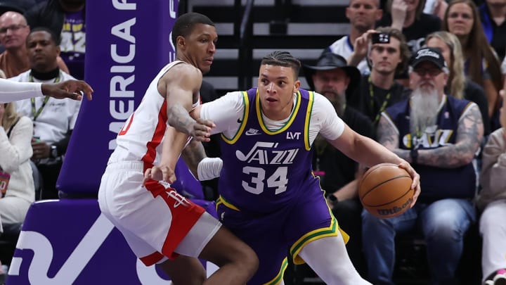 Apr 11, 2024; Salt Lake City, Utah, USA; Utah Jazz forward Kenneth Lofton Jr. (34) and Houston Rockets forward Jabari Smith Jr. (10) battle for position during the third quarter at Delta Center. Mandatory Credit: Rob Gray-USA TODAY Sports