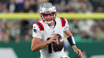 Sep 19, 2024; East Rutherford, New Jersey, USA; New England Patriots quarterback Drake Maye (10) looks to pass against the New York Jets during the fourth quarter at MetLife Stadium. Mandatory Credit: Brad Penner-Imagn Images