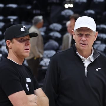 Apr 28, 2022; Salt Lake City, Utah, USA; Utah Jazz owner Ryan Smith speaks with Utah Jazz CEO of basketball operations Danny Ainge prior to a game against the Dallas Mavericks during game six of the first round for the 2022 NBA playoffs at Vivint Arena. Mandatory Credit: Rob Gray-USA TODAY Sports
