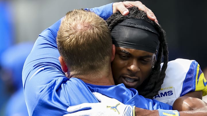 Los Angeles Rams wide receiver Davante Adams (17) hugs coach Sean McVay. Mandatory Credit: Kiyoshi Mio-Imagn Images