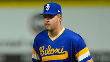 Biloxi Shuckers Blake Burke (38) covers first base as Knoxville Smokies' Reivaj Garcia (22) leads off base during a minor league baseball game on August 5, 2025, Knoxville, Tennessee.