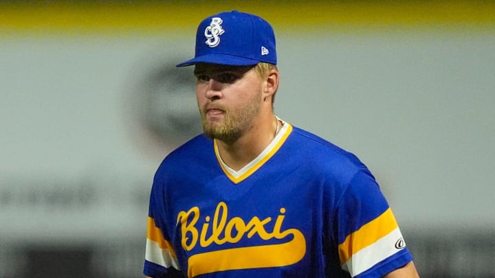 Biloxi Shuckers Blake Burke (38) covers first base as Knoxville Smokies' Reivaj Garcia (22) leads off base during a minor league baseball game on August 5, 2025, Knoxville, Tennessee.