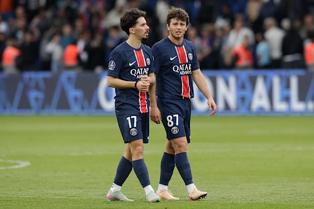 Vitinha and João Neves walking alongside one another.