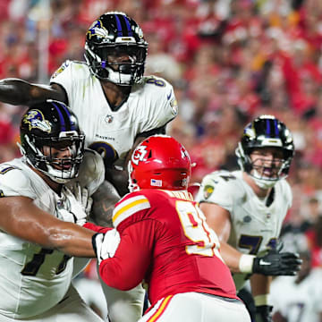 Sep 5, 2024; Kansas City, Missouri, USA; Baltimore Ravens quarterback Lamar Jackson (8) throws a pass against the Kansas City Chiefs during the first half at GEHA Field at Arrowhead Stadium.