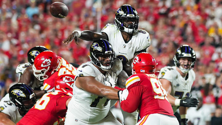 Sep 5, 2024; Kansas City, Missouri, USA; Baltimore Ravens quarterback Lamar Jackson (8) throws a pass against the Kansas City Chiefs during the first half at GEHA Field at Arrowhead Stadium.