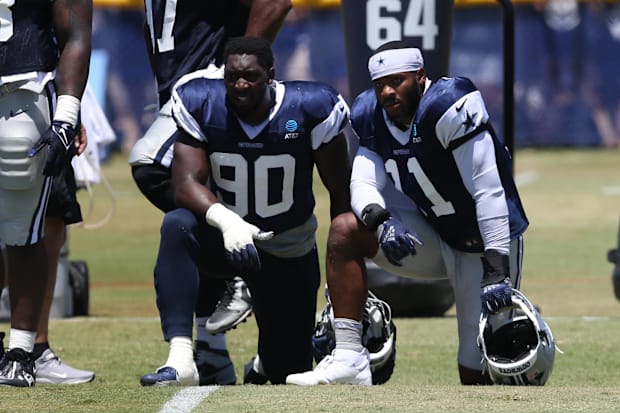 Dallas Cowboys defensive end DeMarcus Lawrence and linebacker Micah Parsons during training camp.