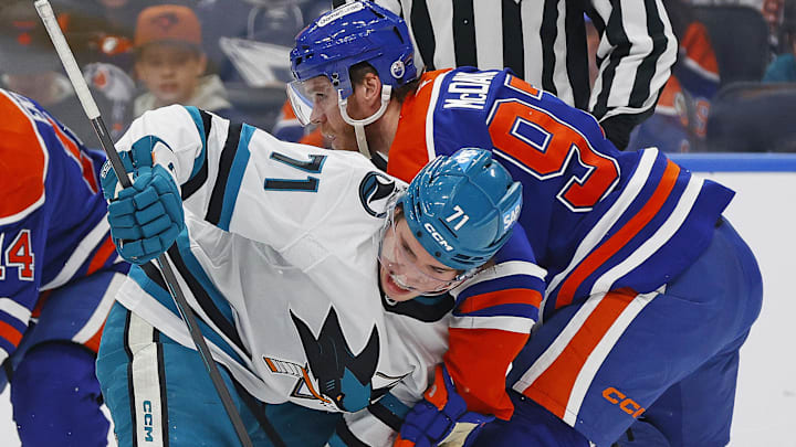 Jan 29, 2026; Edmonton, Alberta, CAN; San Jose Sharks forward Macklin Celebrini (71) and Edmonton Oilers forward Connor McDavid (97) battle for a loose puck during the second period at Rogers Place. Mandatory Credit: Perry Nelson-Imagn Images