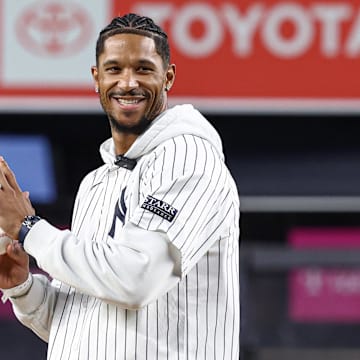 Sep 24, 2024; Bronx, New York, USA;  New York Knick guard Josh Hart throws out the first pitch before the game between the New York Yankees and the Baltimore Orioles at Yankee Stadium. Mandatory Credit: Vincent Carchietta-Imagn Images