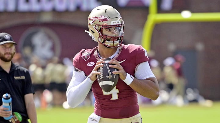 Sep 14, 2024; Tallahassee, Florida, USA; Florida State Seminoles quarterback DJ Uiagalelei (4) warms up before a game against the Memphis Tigers at Doak S. Campbell Stadium. Mandatory Credit: Melina Myers-Imagn Images