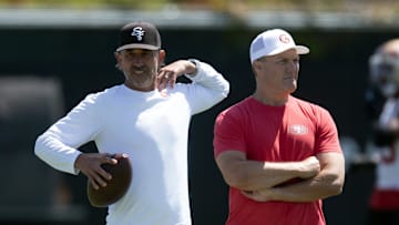 Jun 10, 2025; Santa Clara, CA, USA; San Francisco 49ers head coach Kyle Shanahan (left) and general manager John Lynch watch their team work out during an OTA at Levi's Stadium. Mandatory Credit: D. Ross Cameron-Imagn Images
