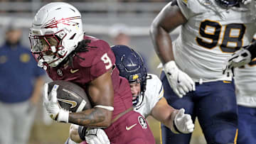Sep 21, 2024; Tallahassee, Florida, USA; Florida State Seminoles running back Lawrance Toafili (9) runs the ball during the first half against the California Golden Bears at Doak S. Campbell Stadium. Mandatory Credit: Melina Myers-Imagn Images