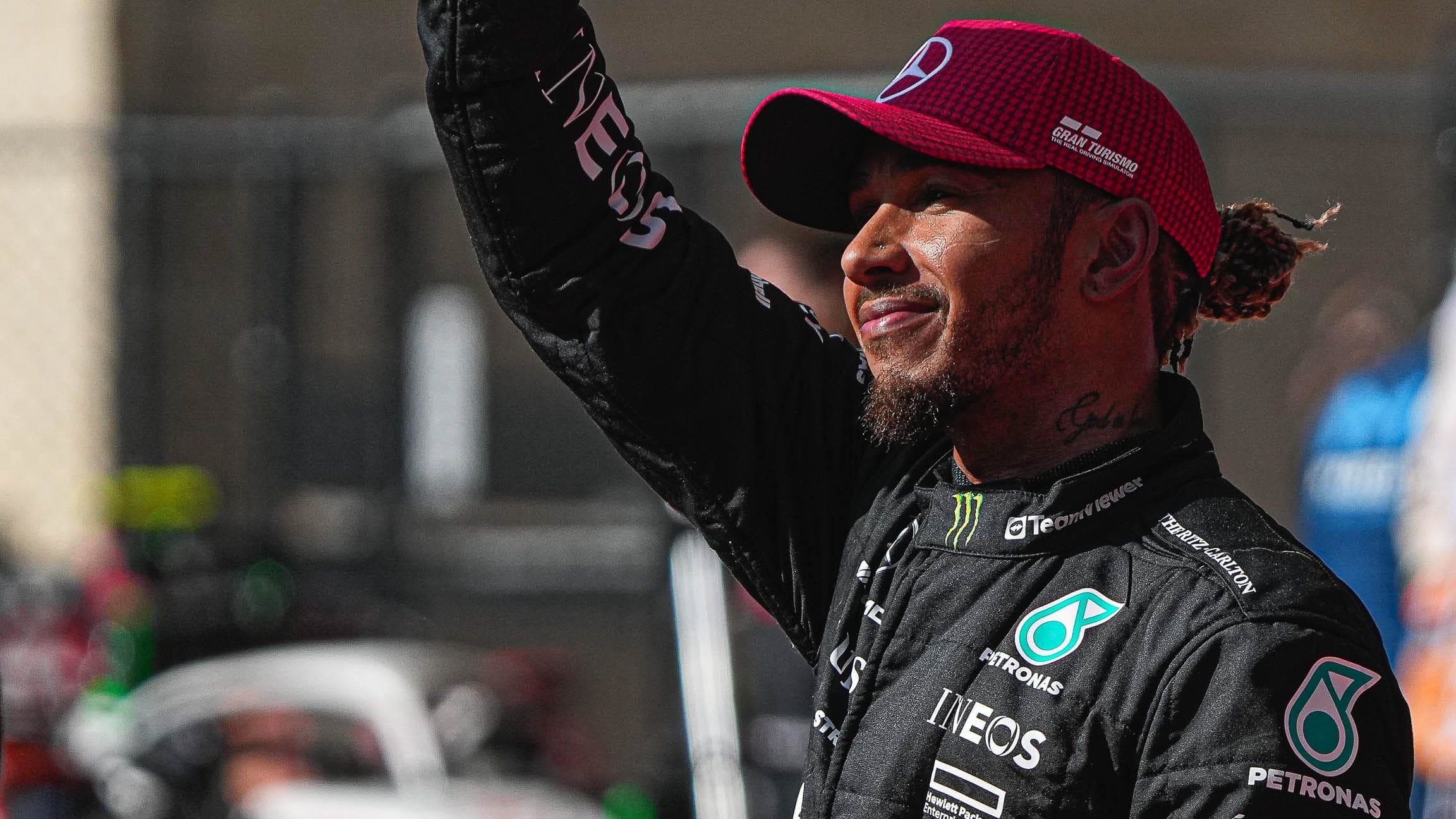 Mercedes AMG Petronas driver Lewis Hamilton waves to the fans after after a second place podium