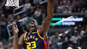 Green lays up a shot. 