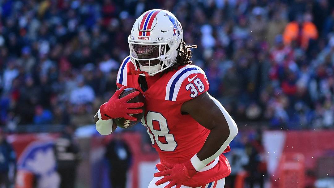 Dec 1, 2024; Foxborough, Massachusetts, USA; New England Patriots running back Rhamondre Stevenson (38) runs the ball while Indianapolis Colts safety Nick Cross (20) defends during the first half at Gillette Stadium. Mandatory Credit: Bob DeChiara-Imagn Images Dec 1, 2024; Foxborough, Massachusetts, USA; New England Patriots running back Rhamondre Stevenson (38) runs the ball while Indianapolis Colts safety Nick Cross (20) defends during the first half at Gillette Stadium. Mandatory Credit: Bob DeChiara-Imagn Images