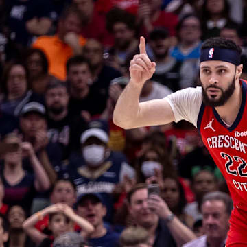 Apr 19, 2024; New Orleans, Louisiana, USA;  New Orleans Pelicans forward Larry Nance Jr. (22) reacts to making a basket against Sacramento Kings forward Harrison Barnes (40) in the second half during a play-in game of the 2024 NBA playoffs at Smoothie King Center. Mandatory Credit: Stephen Lew-Imagn Images