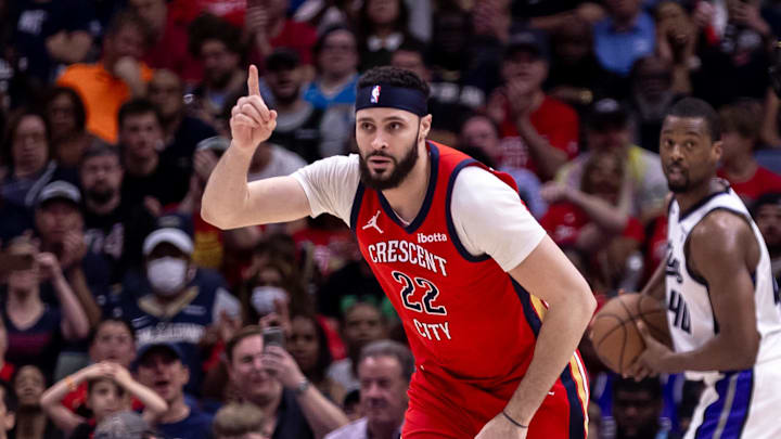 Apr 19, 2024; New Orleans, Louisiana, USA;  New Orleans Pelicans forward Larry Nance Jr. (22) reacts to making a basket against Sacramento Kings forward Harrison Barnes (40) in the second half during a play-in game of the 2024 NBA playoffs at Smoothie King Center. Mandatory Credit: Stephen Lew-Imagn Images