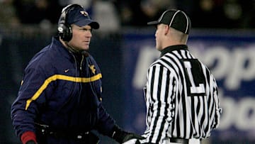 Oct 20, 2006; East Hartford, CT, USA; West Virginia Mountaineers head coach Rich Rodriguez questions the linesman in the 1st quarter against the Connecticut Huskies at Rentschler Field. Mandatory Credit: David Butler II-Imagn Images Copyright © David Butler II