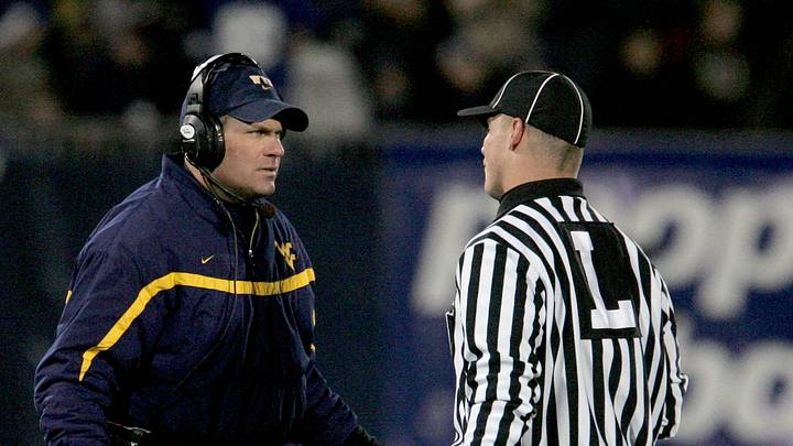 Oct 20, 2006; East Hartford, CT, USA; West Virginia Mountaineers head coach Rich Rodriguez questions the linesman in the 1st quarter against the Connecticut Huskies at Rentschler Field. Mandatory Credit: David Butler II-Imagn Images Copyright © David Butler II
