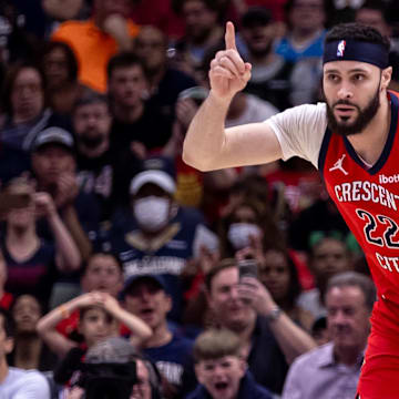 Apr 19, 2024; New Orleans, Louisiana, USA;  New Orleans Pelicans forward Larry Nance Jr. (22) reacts to making a basket against Sacramento Kings forward Harrison Barnes (40) in the second half during a play-in game of the 2024 NBA playoffs at Smoothie King Center. Mandatory Credit: Stephen Lew-Imagn Images